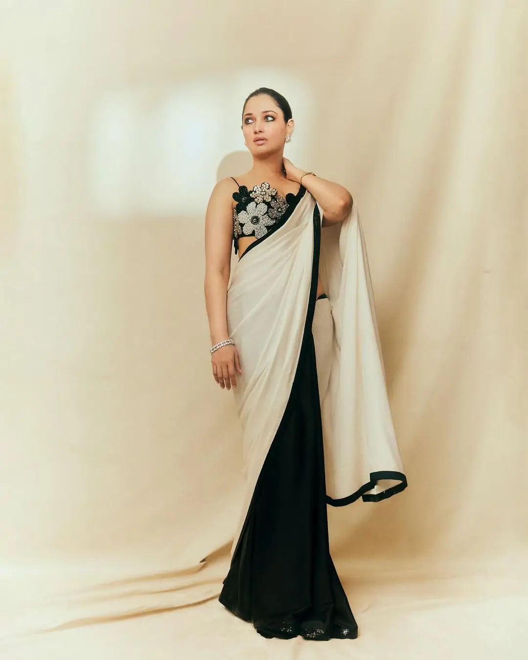 Tamanna Bhatia Stills In White Saree Sleeveless Black Blouse